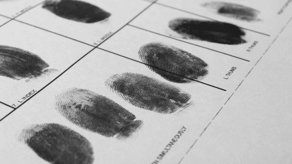 Series of inked finger prints on identification card