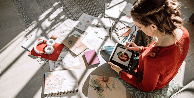 woman drawing on a digital tablet device.